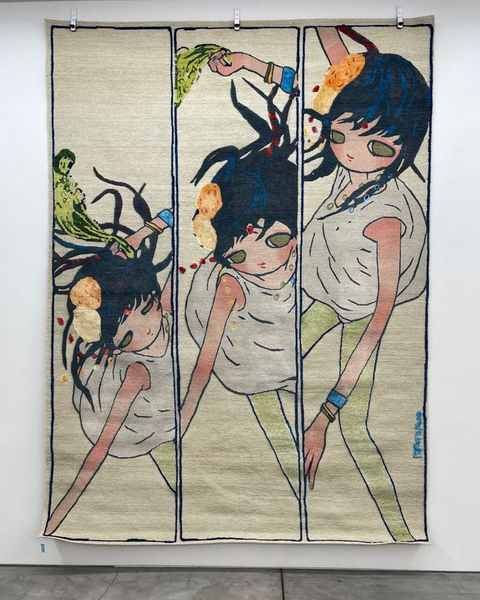 Aya Takano’s hand-knotted work of three girls in three panels, hanging on a white wall