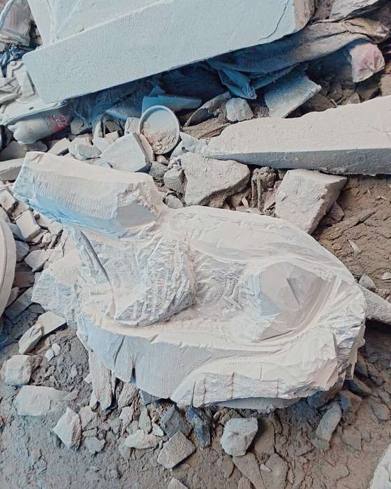 A block of pale stone roughed out into the first shape of the crocodile