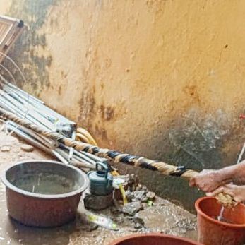 Buckets and a dye bath in the courtyard of the workshop
